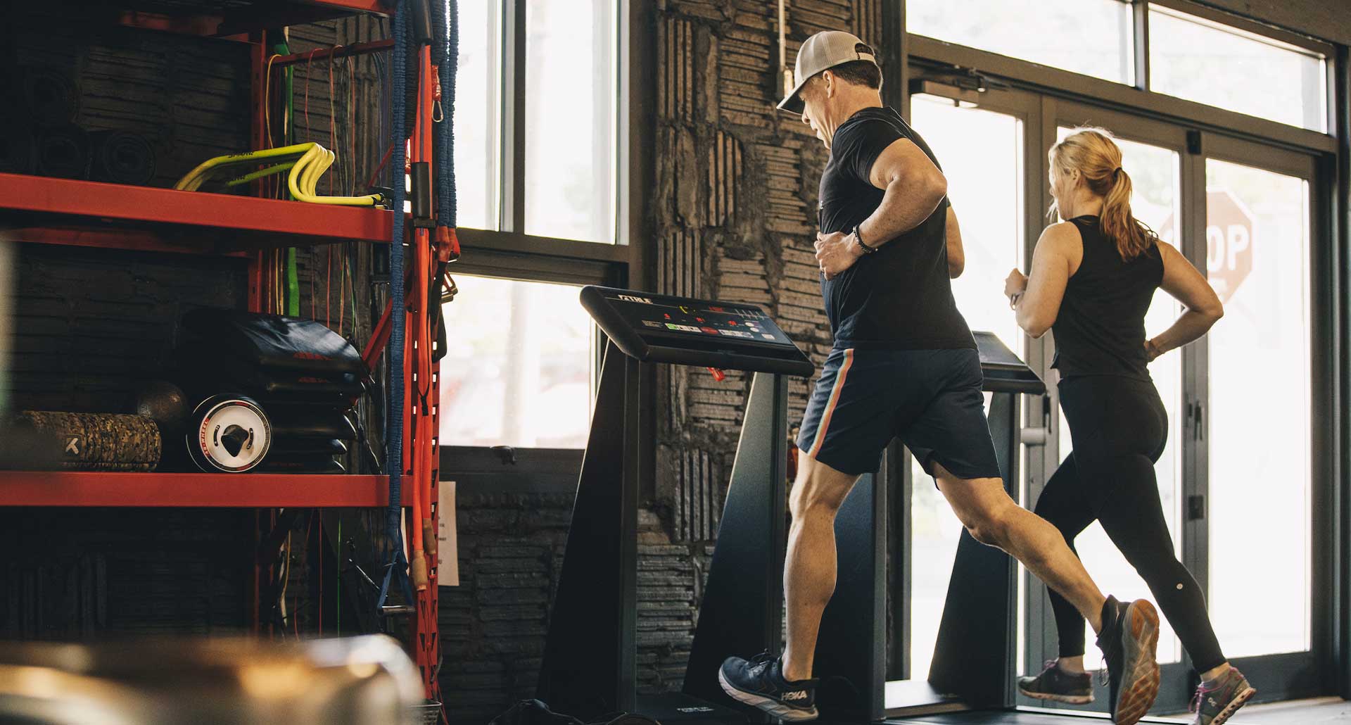 Man and woman running on small group personal training